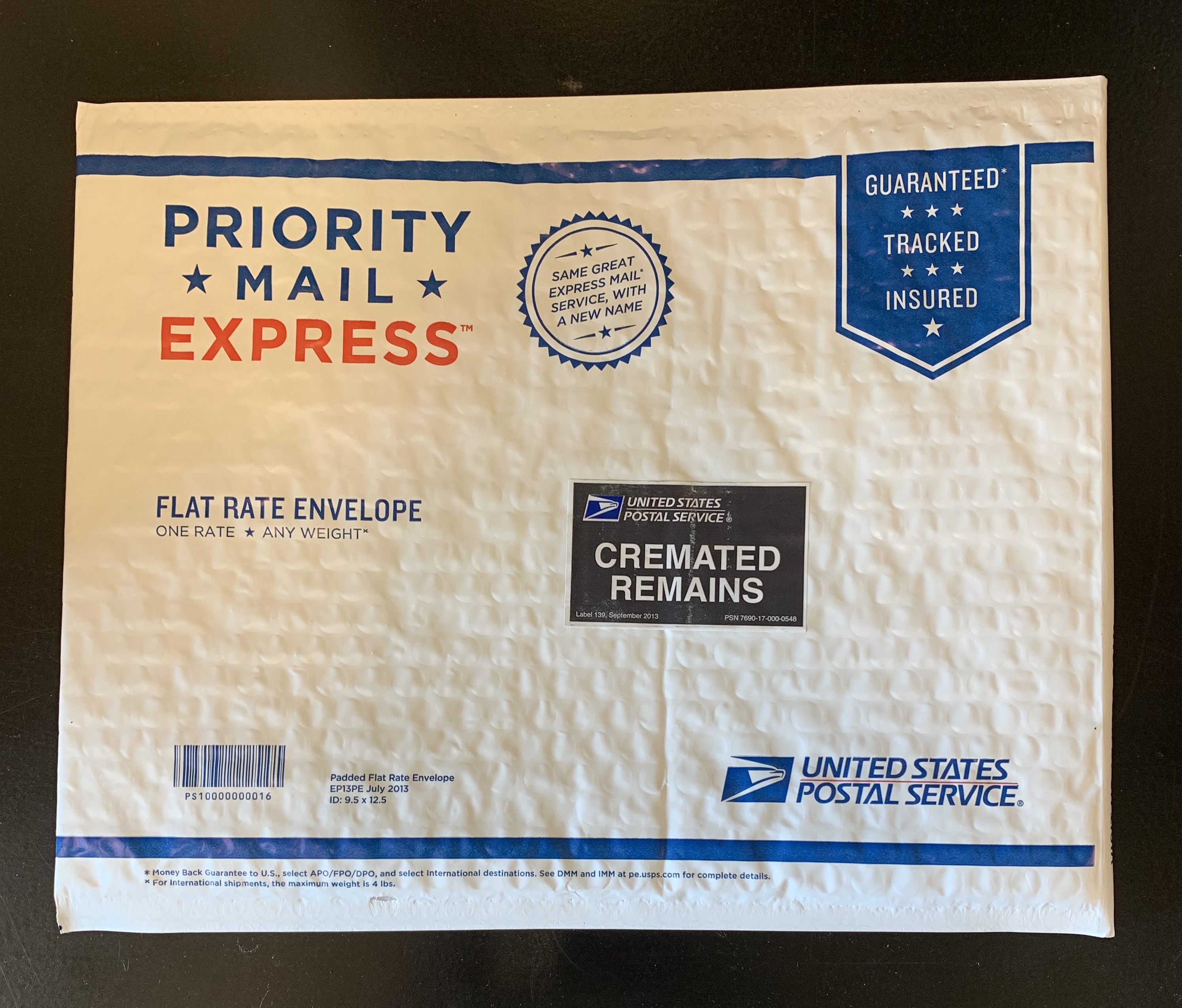 A package of mail with the usps logo on it.