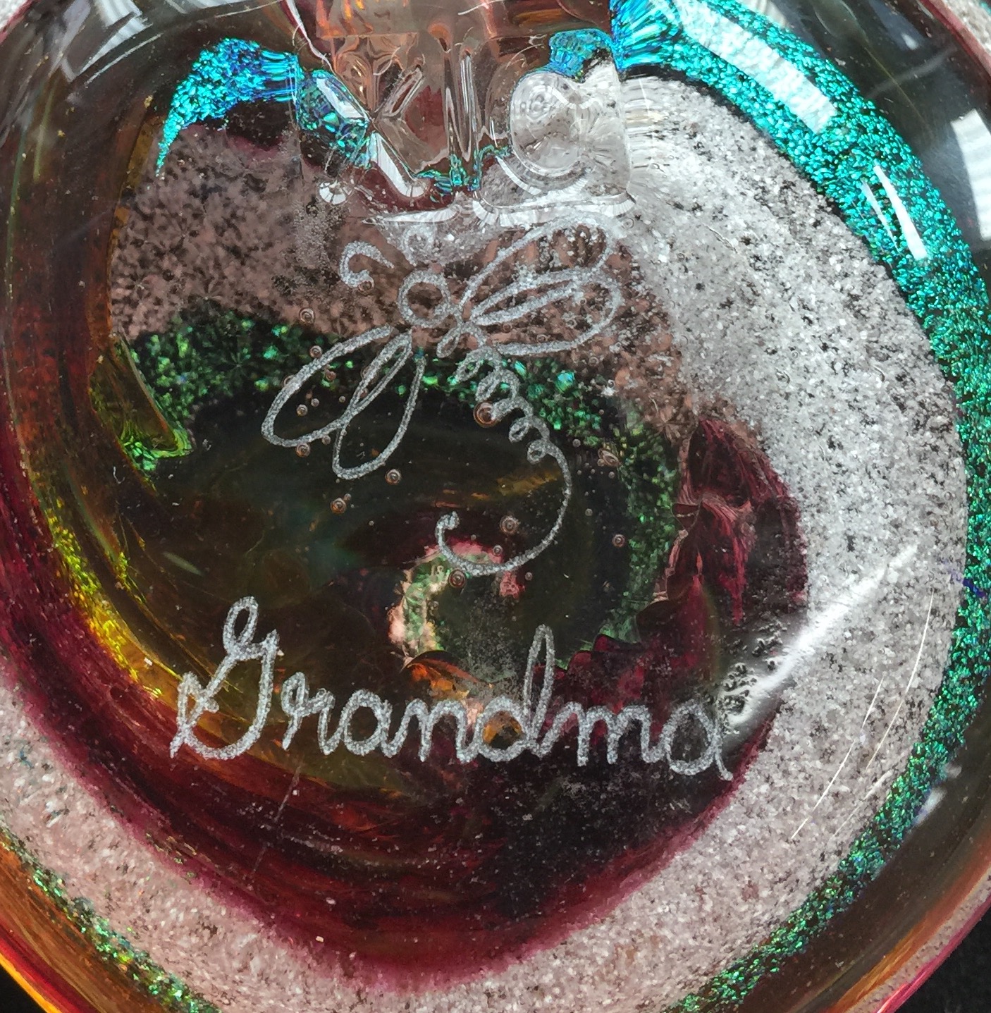 A close up of the bottom of a glass ornament