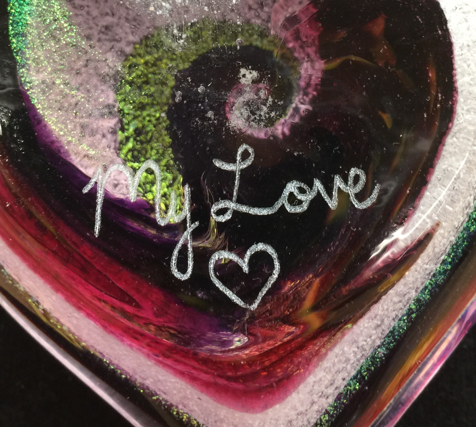 A close up of the words my love written on a glass