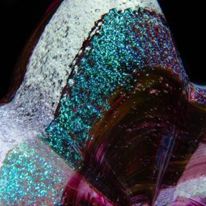 A close up of the side of a glass vase