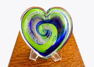 A heart shaped glass sculpture on display.