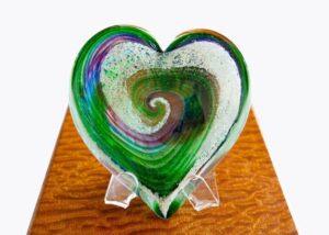 A heart shaped glass dish on display.