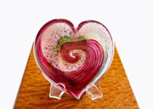 A heart shaped glass dish on display.