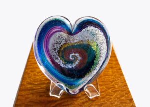 A heart shaped glass dish on display.