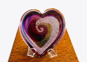 A heart shaped glass dish on display.