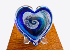 A heart shaped glass sculpture on display.