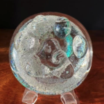 A glass ball with some kind of design on it