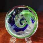 A glass plate with a swirl design on it.